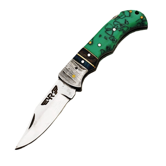 Ruddock Bros folding knife with plastic resin handle in green pattern and Damascus steel with stainless steel blade with leather sheath Ruddock El Paso Texas