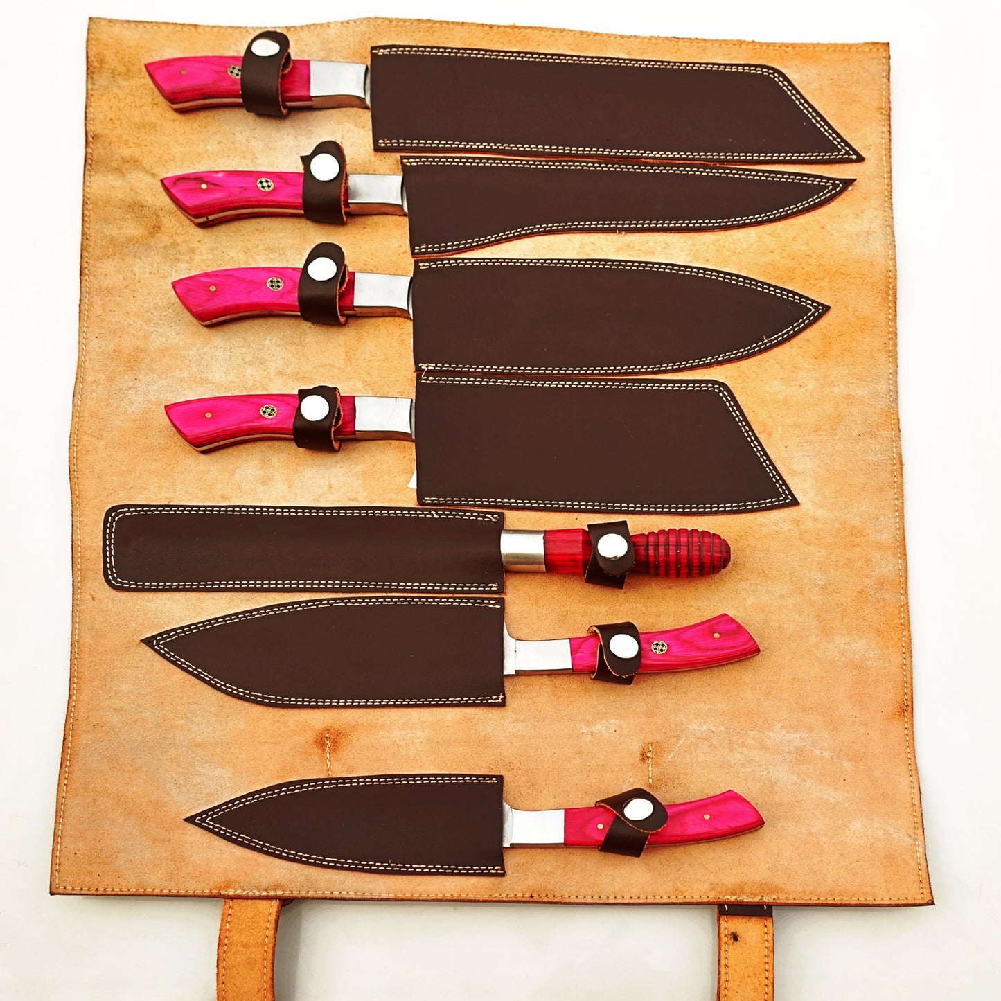 Damascus Steel 7 piece knife set with medium pink hardwood handle with leather carry pouch by Ruddock Bros El Paso Texas USA Ruddock Shirt