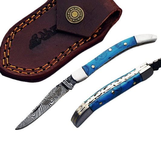 Ruddock Bros slim folding pocket knife with resin plastic handle and Damascus steel blade and leather sheath Ruddock El Paso Texas