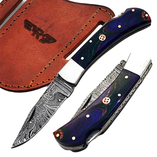 Ruddock Bros folding knife with indigo swirl plastic resin handle with Damascus steel blade with leather sheath Ruddock El Paso Texas