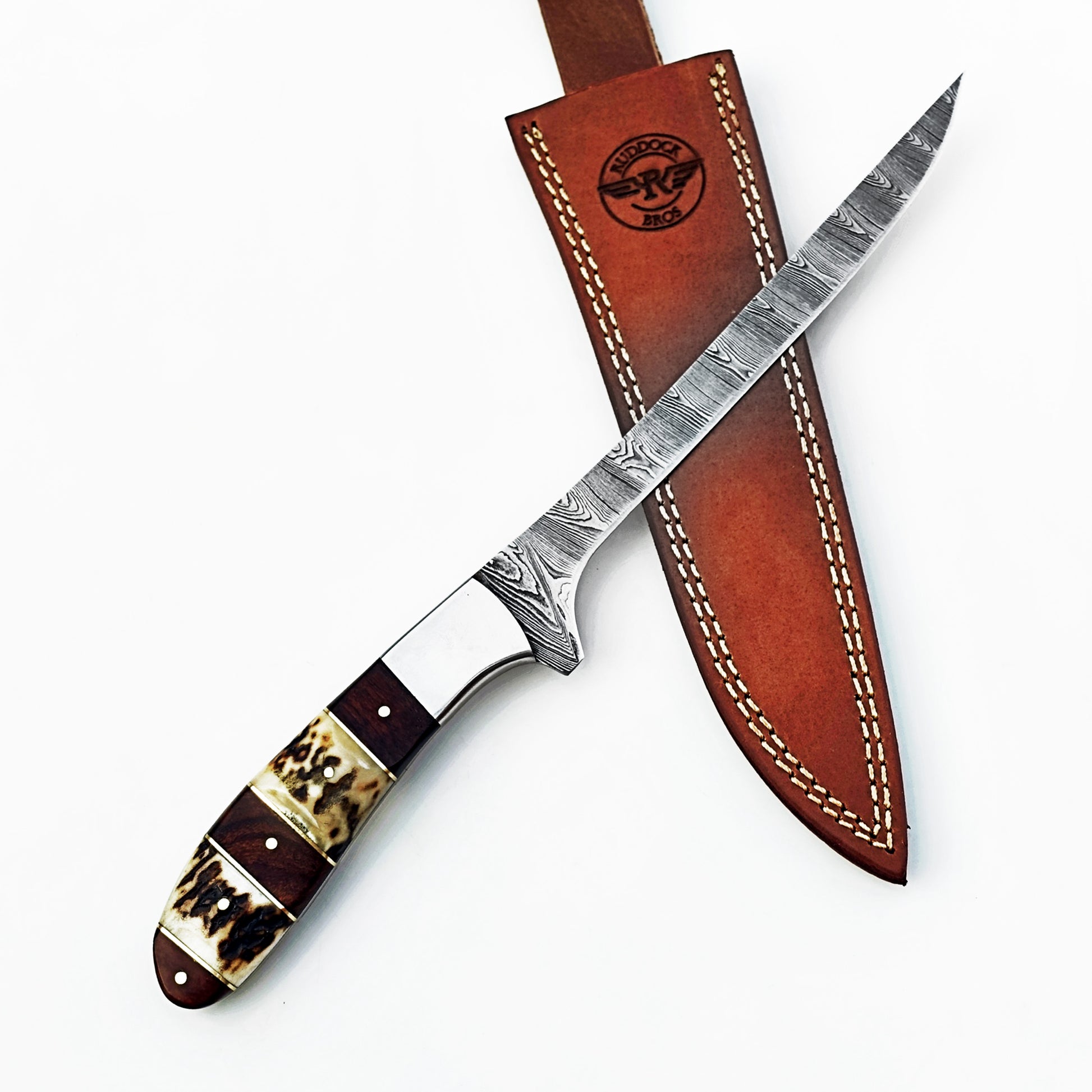 Damascus steel fillet knife by Ruddock Bros with horn and hardwood handle