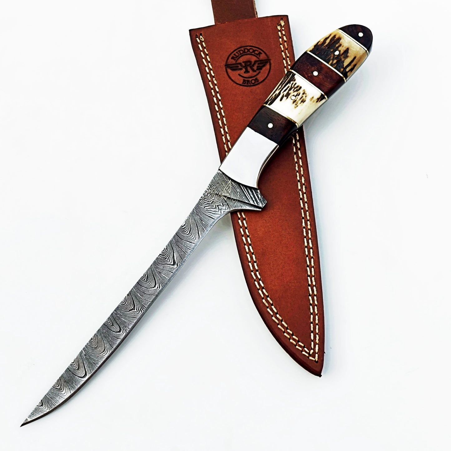 Damascus steel fillet knife by Ruddock Bros with horn and hardwood handle